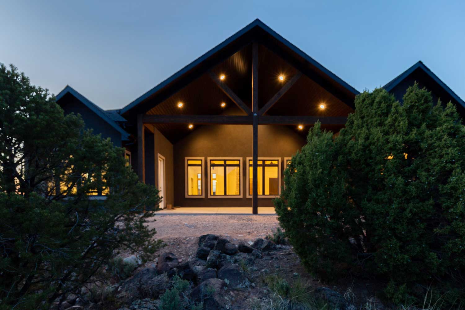 Exterior at night showing the outdoor living space 