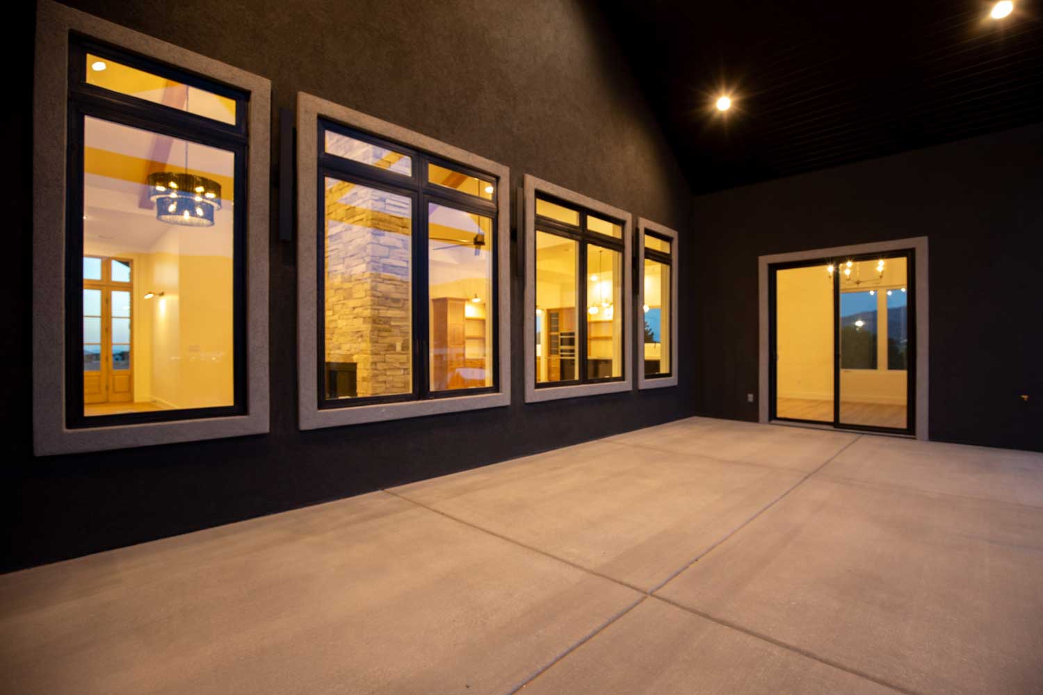 Dark brown stucco exterior surrounding the outdoor patio