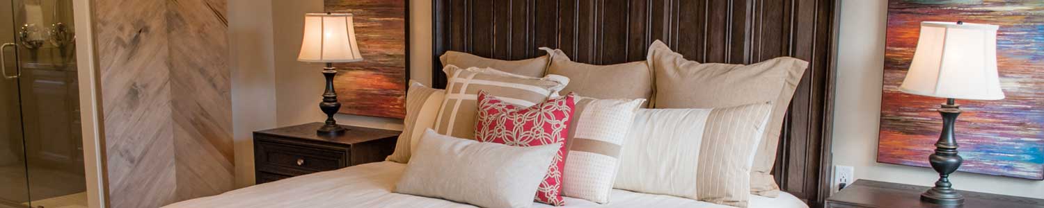 master bedroom with barn door entry to master bath built for a new home