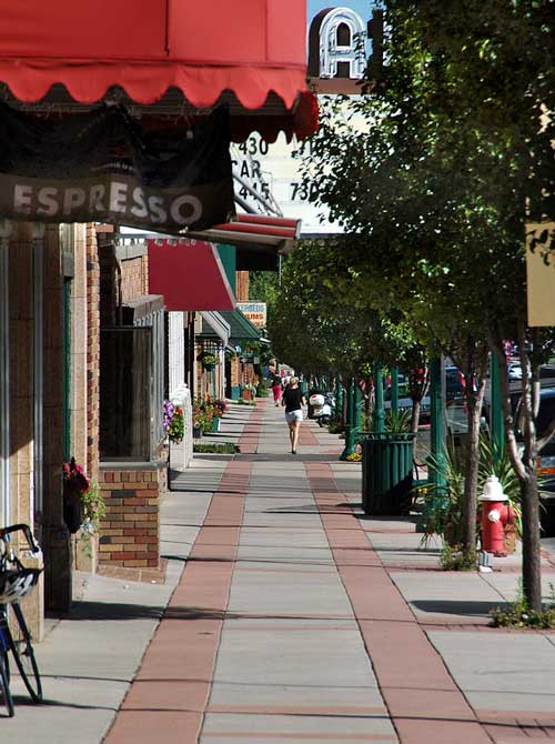 Downtown Cedar City, Utah Woman walking along store fronts of downtown Cedar City, Utah