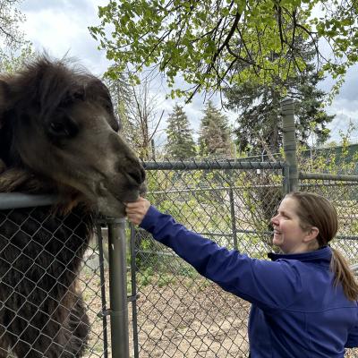 Lisa Chase at zoo with camel