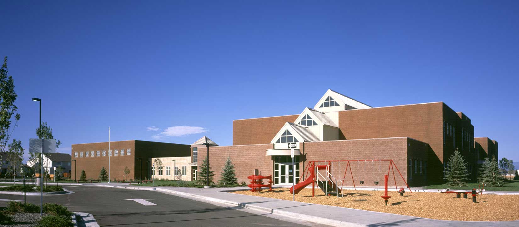Brighton Elementary school building and playground in front