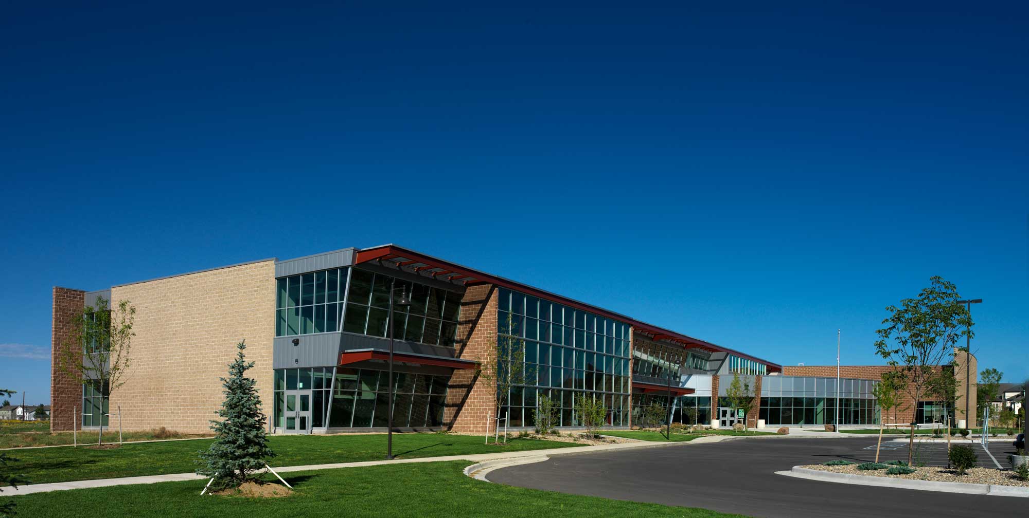 Front entry view of Eagle Ridge Academy featuring windows from the ground floor to second floor.